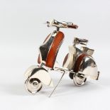 AN ALUMINIUM AND LEATHER MODEL OF A SCOOTER. 11ins long.