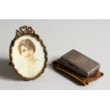 AN OVAL PORTRAIT MINIATURE OF A LADY and A SILVER SNUFF BOX. London 1894 (2).