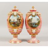 A GOOD PAIR OF SEVRES VASES AND COVERS, with painted panels of rural scenes. 10ins high.
