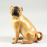 A VERY GOOD LARGE 19TH CENTURY MEISSEN SEATED PUG DOG. Cross swords mark in blue. 8.5ins high.