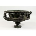A GOOD CARVED SERPENTINE MODEL OF THE WARWICK VASE. 14ins wide.