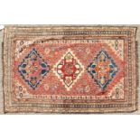 A VERY FINE ANTIQUE PERSIAN QASHQAI TRIBAL RUG, the centre with three motifs within an eleven row