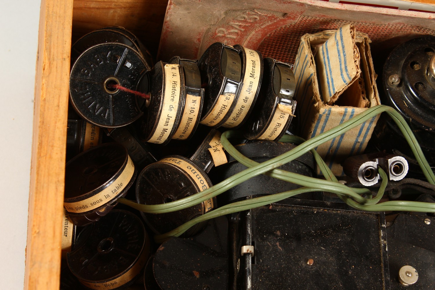 AN EARLY ELECTRIC FILM PROJECTOR, with a quantity of film rolls. - Image 2 of 4