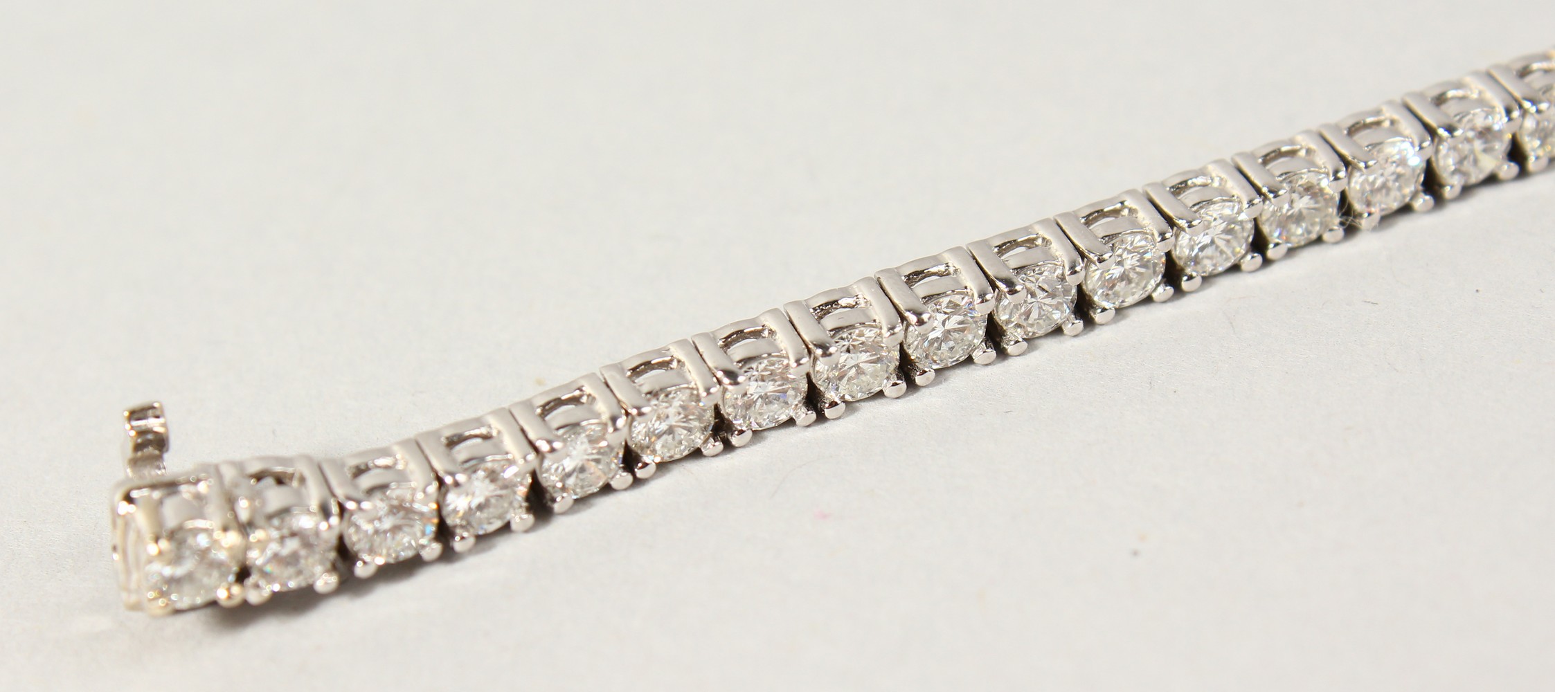 AN 18CT WHITE GOLD DIAMOND LINE BRACELET, with forty-nine diamonds, approx. 6CTS, G/H Colour, V1- - Image 5 of 19