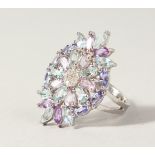 A SILVER, AMETHYST AND BLUE TOPAZ DRESS RING.
