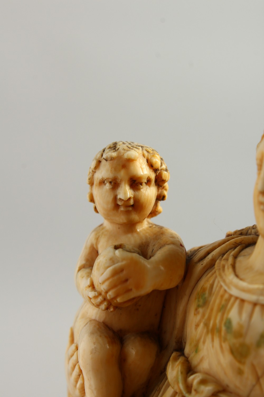 A GOOD 17TH-18TH CENTURY GOAN CARVED IVORY MADONNA AND CHILD on a circular wooden base. 6.25ins - Image 5 of 16