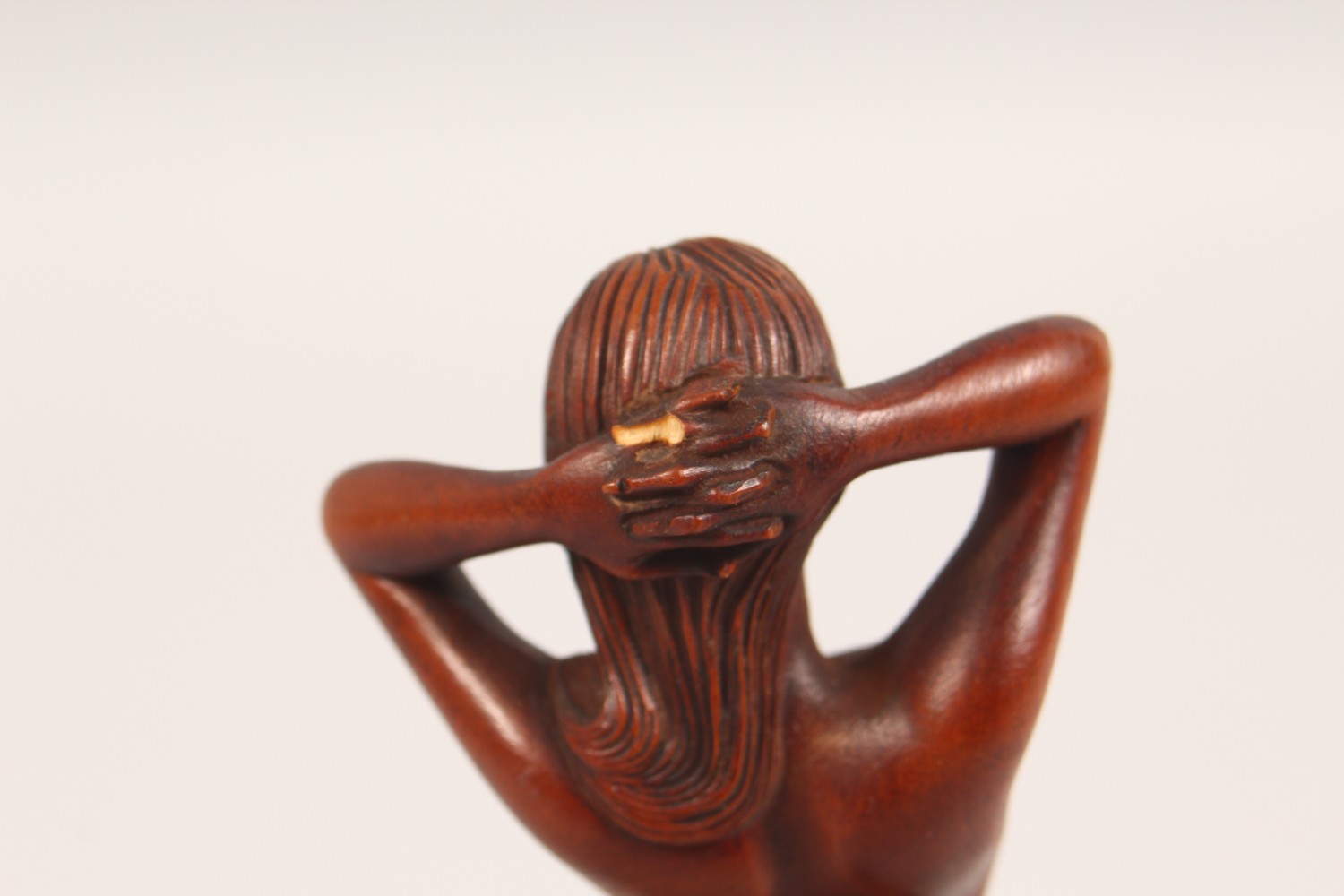 A SMALL CARVED WOOD FIGURE, standing female nude. 7ins high. - Image 3 of 4