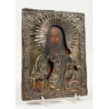 A RUSSIAN ICON, with silver overlay. Maker: A.H. 1865. 8.5ins x 6.5ins.