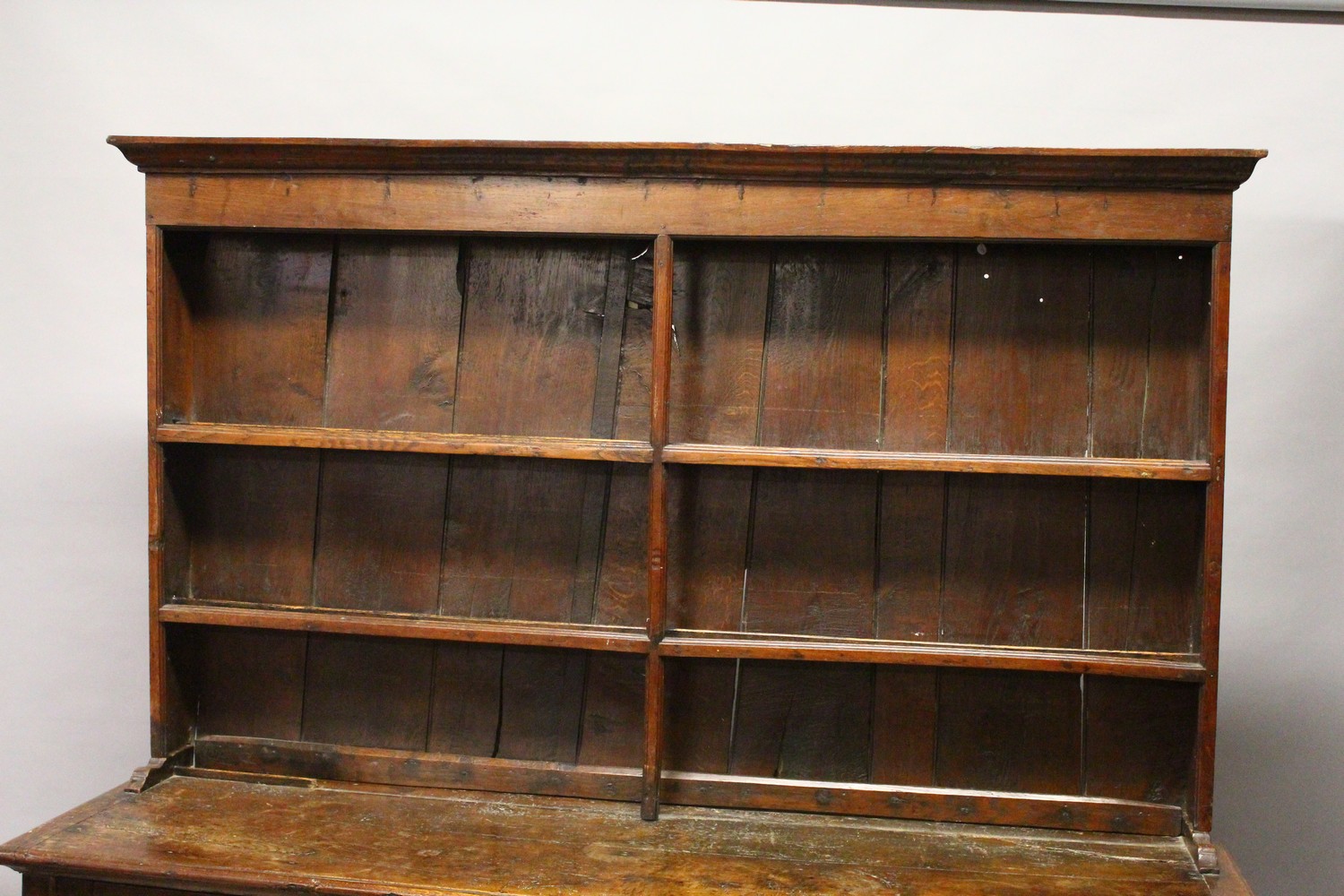 AN 18TH CENTURY OAK DRESSER, with a double Delft rack, the base with three cupboard doors, each part - Image 5 of 6