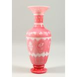 A PINK "DOLCE RELIVO" OPAQUE GLASS BALUSTER SHAPED VASE, with incised floral & grape and vine