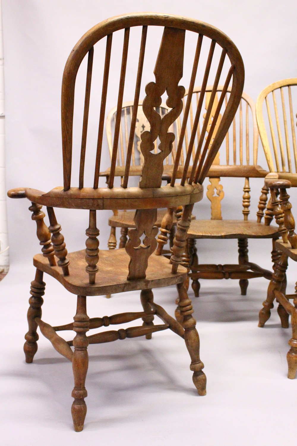 A GOOD SET OF FOUR 19TH CENTURY OAK WINDSOR HIGH BACK ARMCHAIRS. - Image 10 of 11