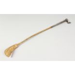 AN EASTERN SILVER HANDLED RIDING CROP. 25ins long.