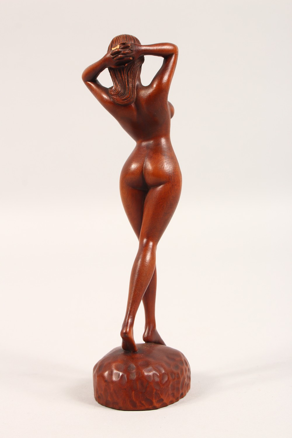 A SMALL CARVED WOOD FIGURE, standing female nude. 7ins high. - Image 2 of 4