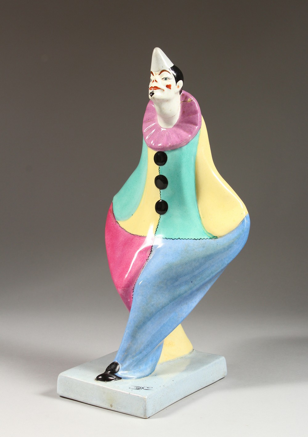 A DAX COLOURFUL POTTERY FIGURE OF A CLOWN (AF). 13.5ins high.