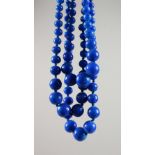 A LAPIS STYLE THREE-ROW NECKLACE.