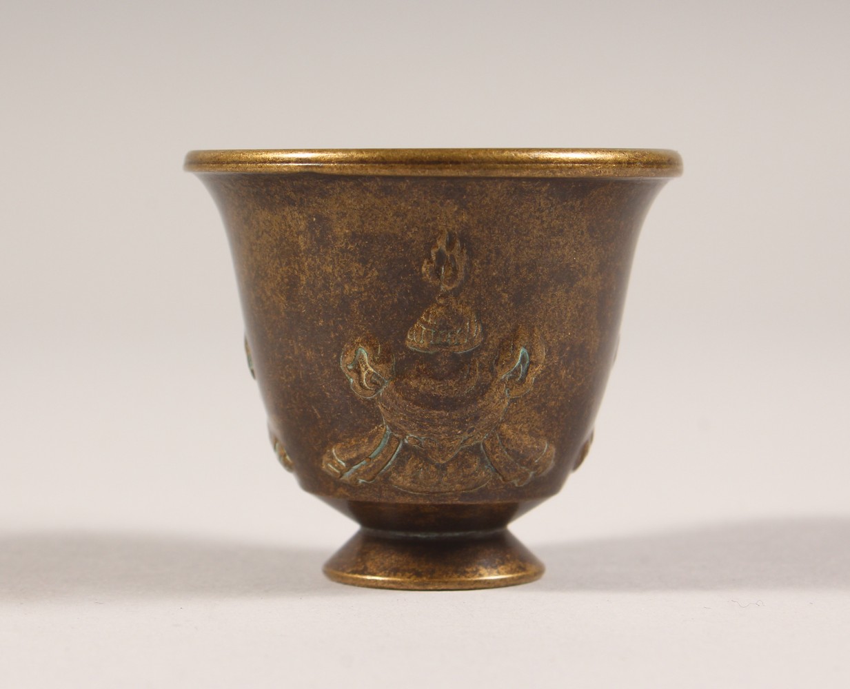 A MINIATURE BRONZE CUP. 1.75ins high.