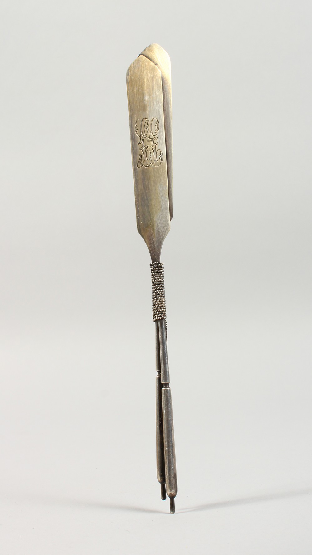 AN UNUSUAL RUSSIAN SILVER LETTER OPENER, modelled as a pair of oars, boxed. 9.5ins long.