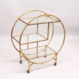 AN ART DECO STYLE THREE TIER CIRCULAR COCKTAIL TROLLEY. 2ft 8ins wide x 3ft 1ins high.