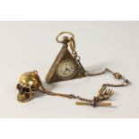 A BRASS MASONIC WATCH SKULL on a chain.