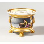 A COALPORT DRUM INKWELL, with lion head masks and four paw feet, painted with a girl in a