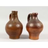 TWO SMALL BELLARMINE JUGS. 6.5ins and 6.75ins high.