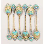 A SET OF SIX RUSSIAN SILVER AND ENAMEL TEASPOONS. 6ins long.
