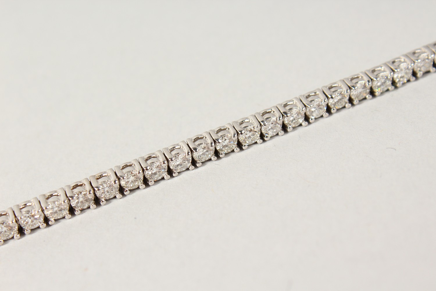 AN 18CT WHITE GOLD DIAMOND LINE BRACELET, with forty-nine diamonds, approx. 6CTS, G/H Colour, V1- - Image 9 of 19