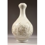 A BLANC DE CHINE GARLIC NECK VASE, with moulded dragon decoration. 15ins high.