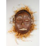 A CARVED WOOD TRIBAL MASK "TSHOKWE LWENA SHABA". 7.5ins high.