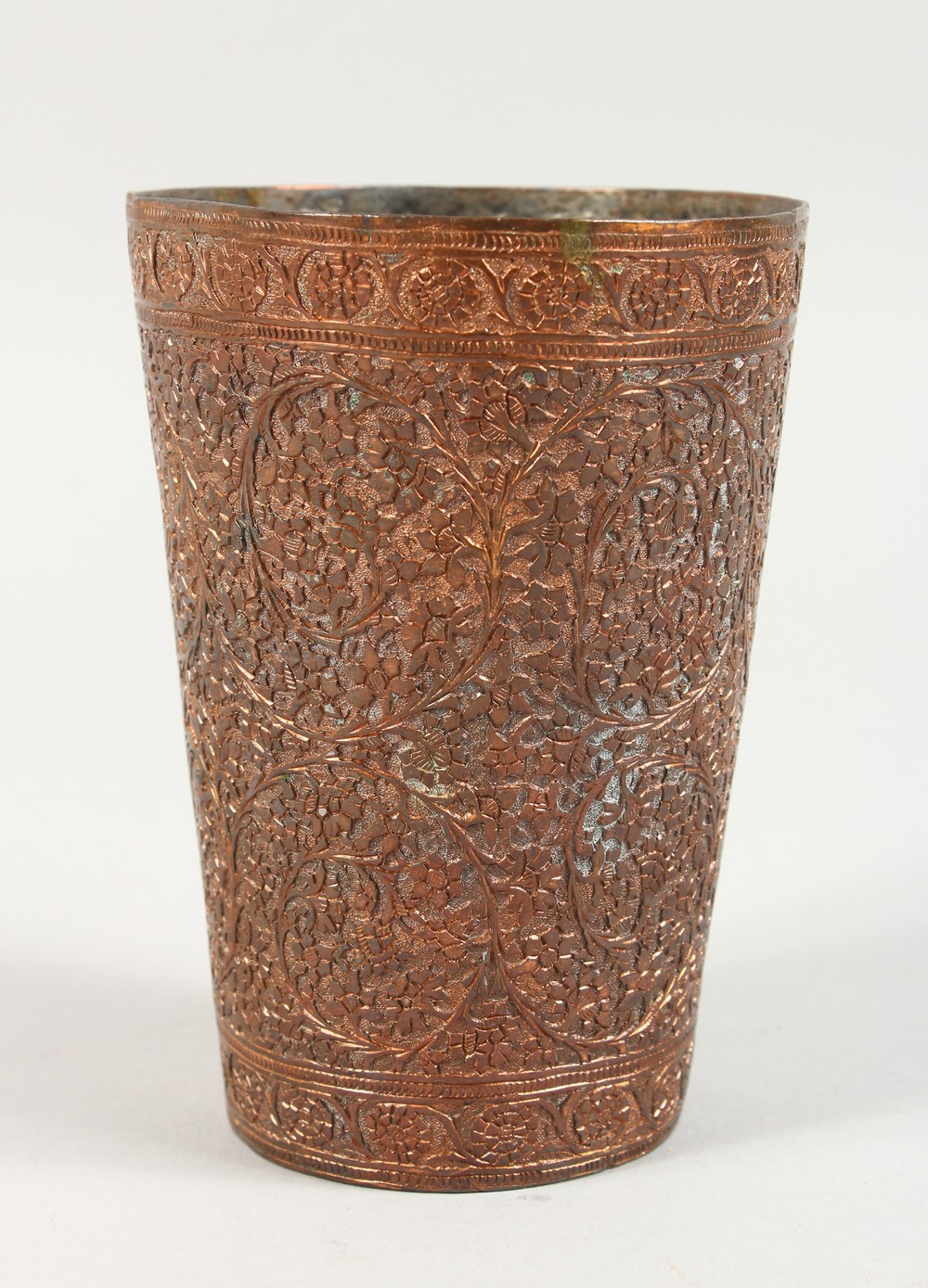 A 19TH CENTURY EASTERN FOLIATE ENGRAVED COPPER BEAKER. 4.75ins high.