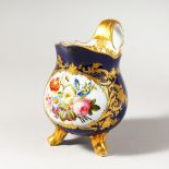 A FINE PARIS PORCELAIN THREE FOOTED JUG, with raised gilding, blue ground painted with flowers,