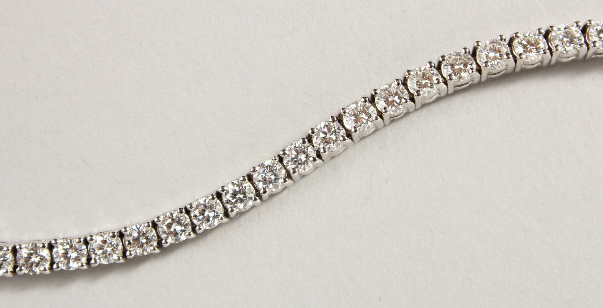 AN 18CT WHITE GOLD DIAMOND LINE BRACELET, with forty-nine diamonds, approx. 6CTS, G/H Colour, V1- - Image 2 of 19