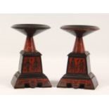A PAIR OF EGYPTIAN REVIVAL BACK SLATE AND ROUGE MARBLE TAZZA'S, inlaid with Egyptian figures. 9.5ins