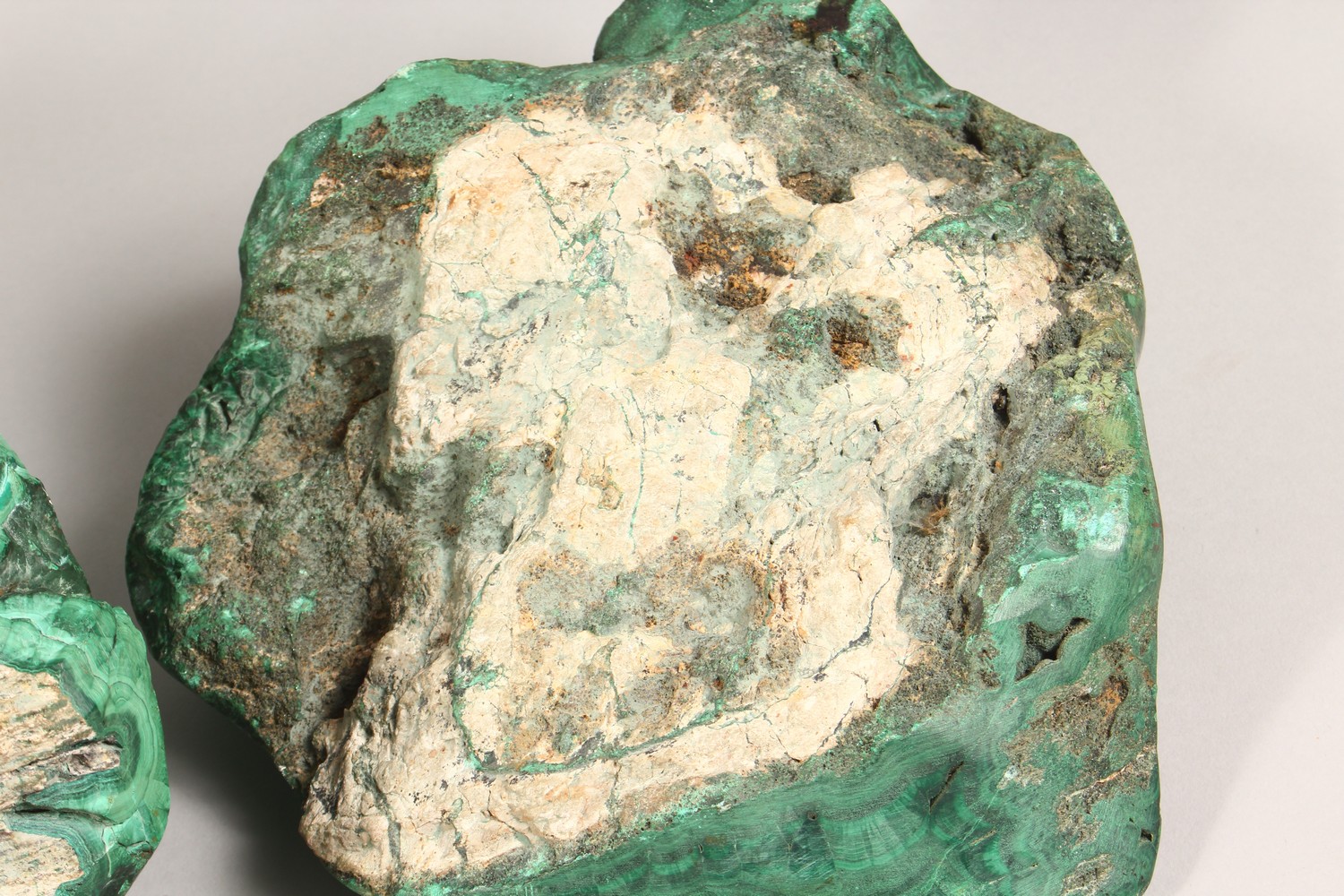 A LARGE NATURALISTIC PIECE OF MALACHITE, partially carved to form a dish, and two similar pieces ( - Image 9 of 9