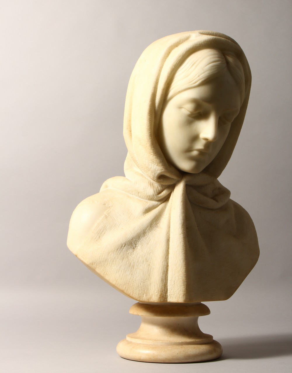 JOHN DENTON CRITTENDEN (1834-1877) A GOOD CARVED WHITE MARBLE BUST OF A YOUNG LADY, wearing a