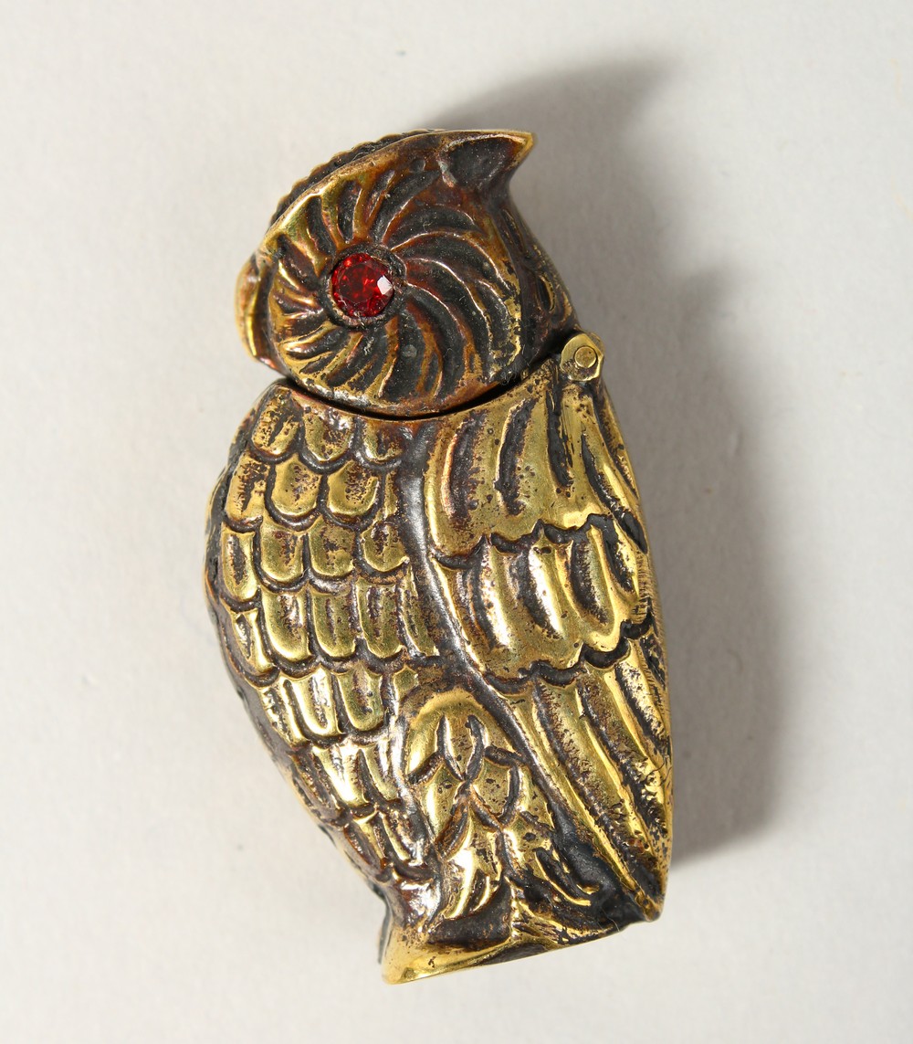 A BRASS OWL VESTA.