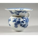 A MEISSEN SPITTOON, blue floral painted decoration with a scroll handle. crossed swords mark to