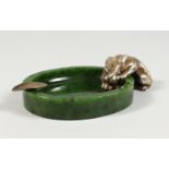 AN UNUSUAL RUSSIAN SILVER AND JADE ASHTRAY, modelled as a panther at a watering hole. 7.5ins wide.