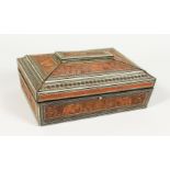 A HUNTLEY & PALMERS BISCUIT TIN, modelled as an eastern carved wood box. 10ins wide.