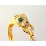 A GOOD SILVER AND GOLD PLATED PANTHER BANGLE.