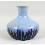 ASHBY GOULD, A PALE AND DARK BLUE SLIP GLAZED BULBOUS VASE, impressed mark to base. 7ins high.