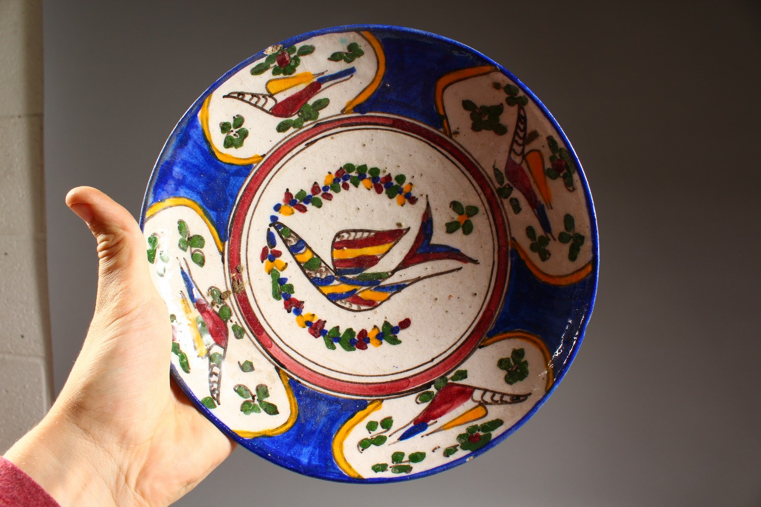 A SET OF FOUR ISLAMIC POTTERY BOWLS, each painted with stylised birds. 9.5ins diameter. - Image 2 of 9