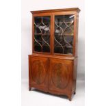 A GEORGE III DESIGN MAHOGANY CUPBOARD BOOKCASE, 19TH CENTURY, with a moulded cornice, pair of