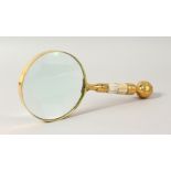 A MAGNIFYING GLASS with mother-of-pearl handle.