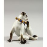 A SMALL MEISSEN FIGURE OF A SEATED DOG, his hind leg raised scratching his ear, crossed swords