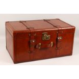 A GOOD LEATHER TRUNK. 24ins wide x 12ins high x 14ins deep.