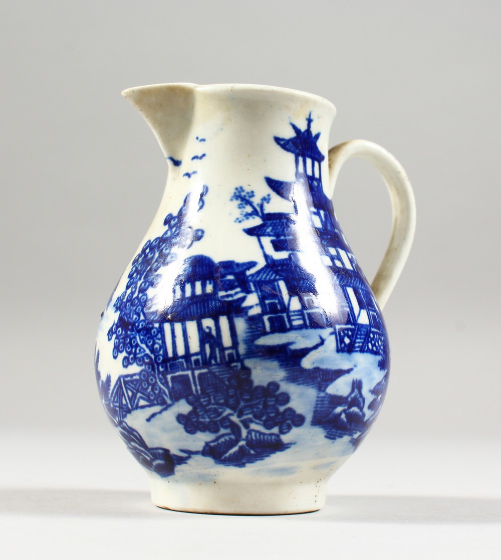 A WILLOW PATTERN DESIGN SPARROW BEAK JUG. 3.5ins high.