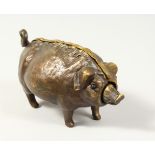 A BRONZE PIG SHAPE DESK BELL. 7ins long.