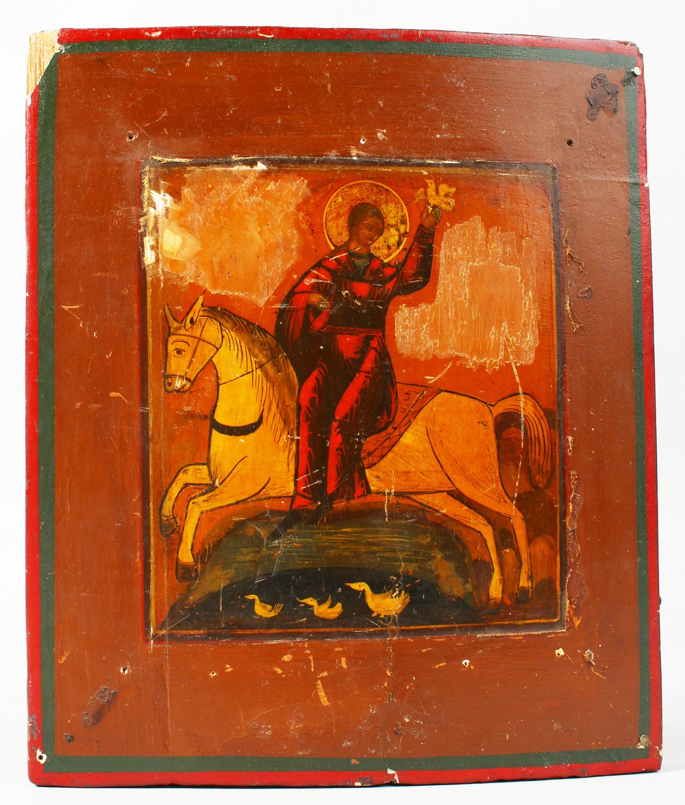 AN 18TH CENTURY ICON, on panel, on horseback. 8.5ins x 7ins.