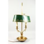 A GOOD STUDENTS TWO-LIGHT LAMP with Toleware shade, on a circular base. 2ft 3ins high.